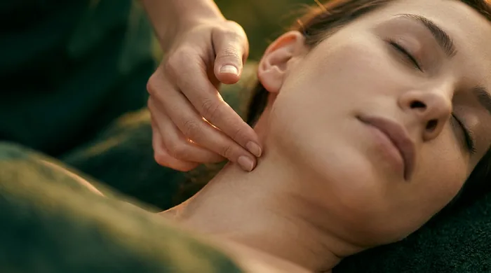 Gentle lymphatic drainage along the neck by a licensed master esthetician at Altru Radiance in Murray, Utah