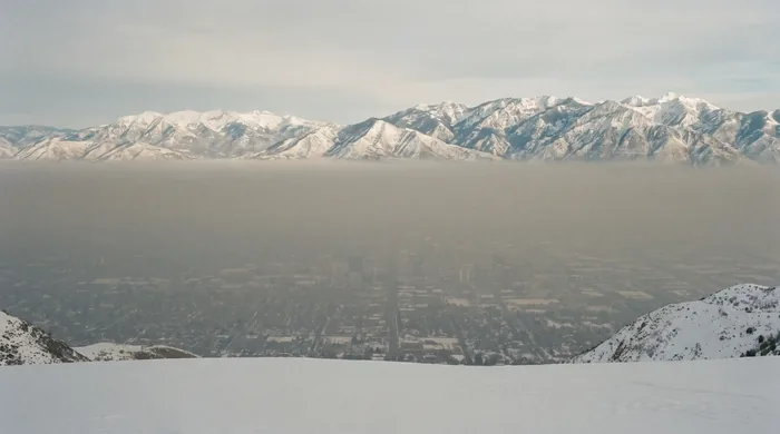 Winter temperature inversion over the Salt Lake Valley, haze trapped below the snow-covered Wasatch Range